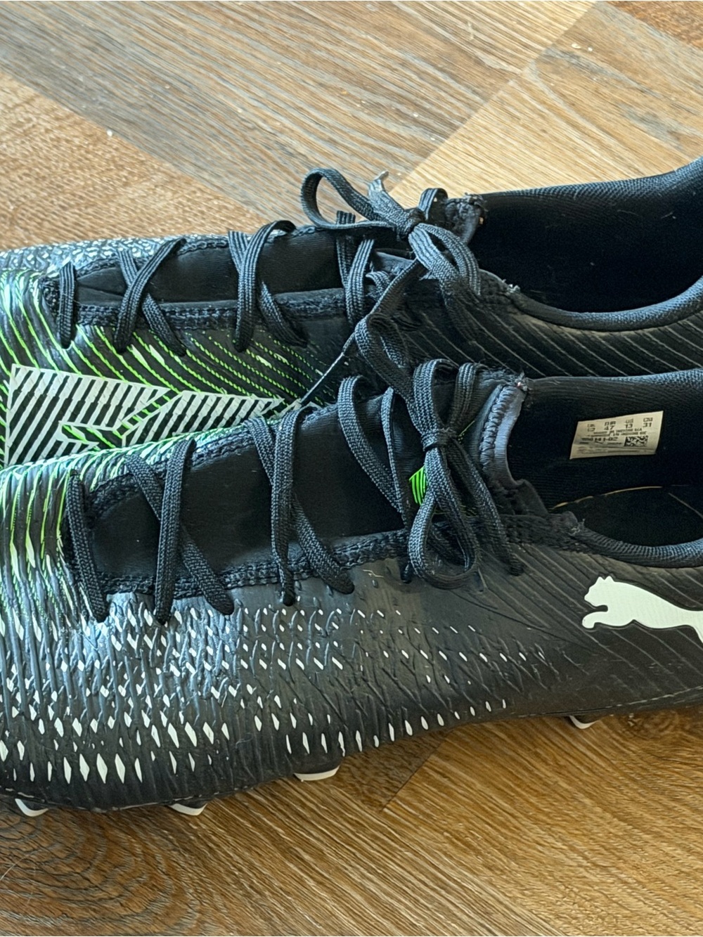 Puma Men's Black Soccer Cleats with Neon Green Accents